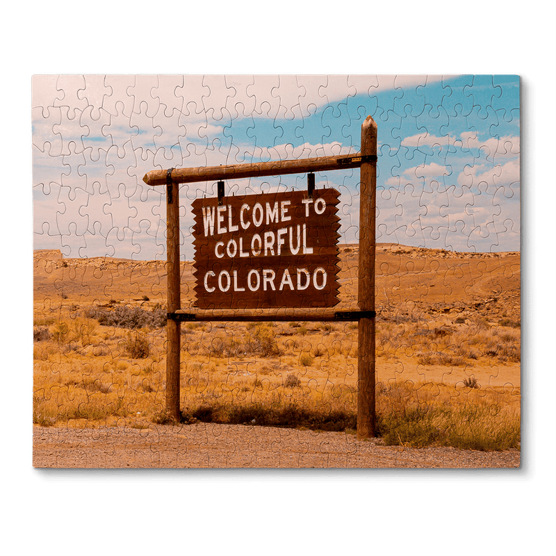 A wood sign that says welcome to colorful Colorado
