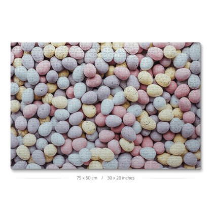 A jigsaw puzzle with 1000 pieces showcasing a photo of pastel chocolate eggs.