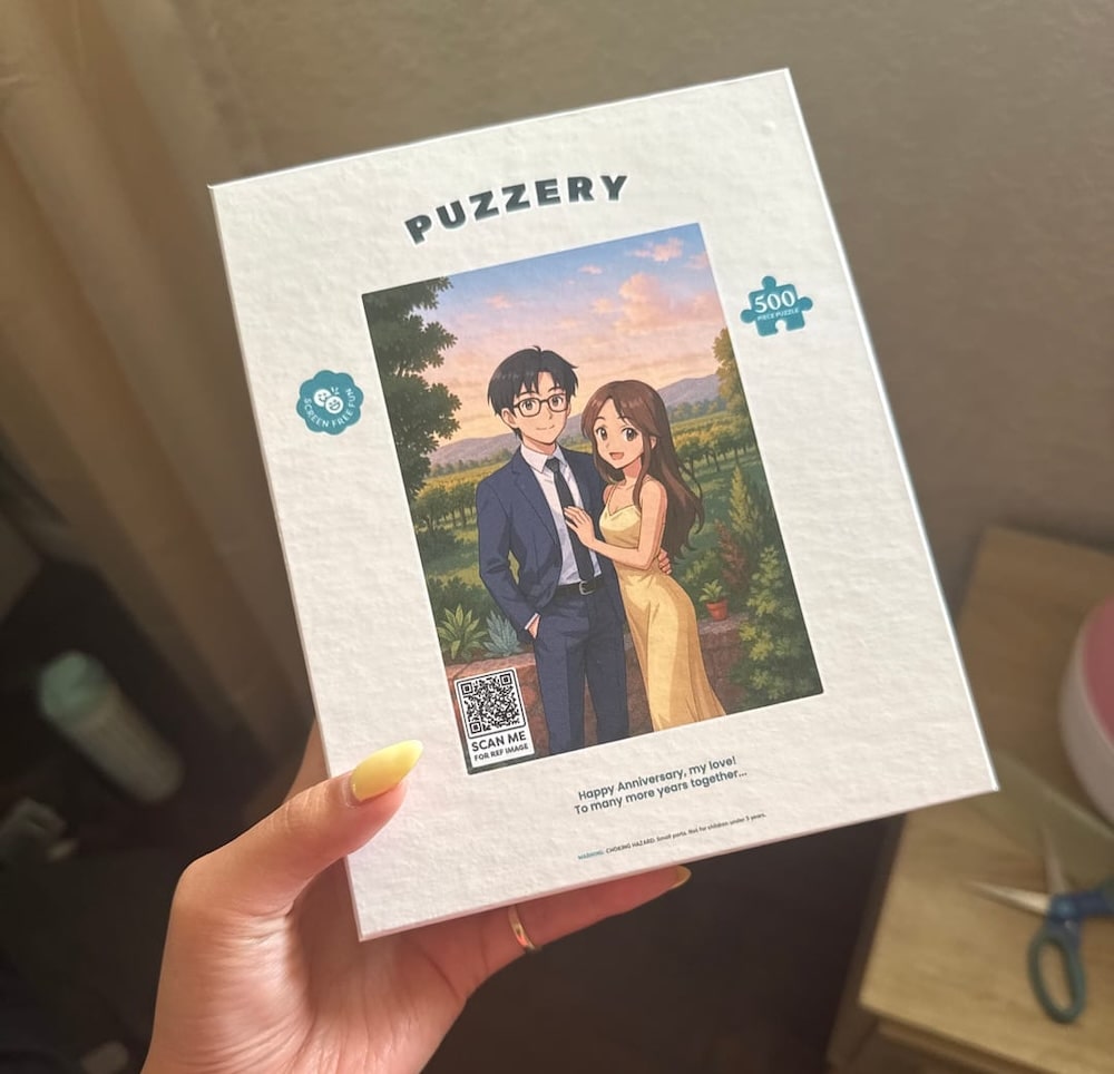 Puzzery puzzle box with illustration of a couple and QR code on a neutral background