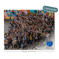 A large group of people gathered outdoors in front of a colorful graffiti wall, with a blue globe graphic in the lower right corner. A teal badge in the upper right says 'Customizable'.