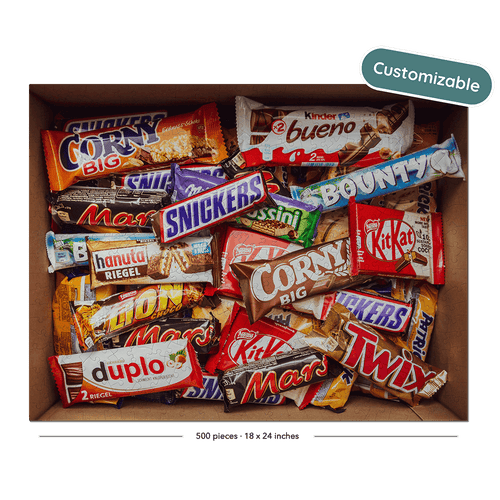 A cardboard box filled with assorted candy bars shown on a black background with a teal 'Customizable' badge in the top right.