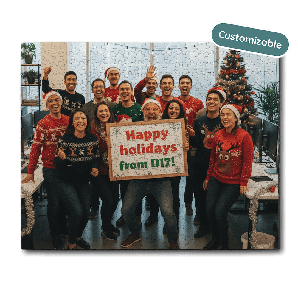 Group of people in festive sweaters with a 'Happy holidays from D17!' sign, surrounded by Christmas decorations.