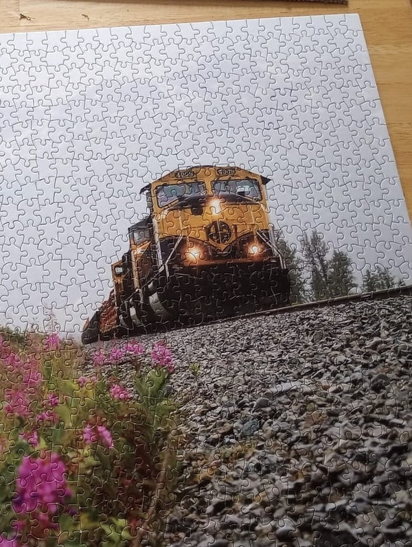 Jigsaw puzzle with a picture of a train on it